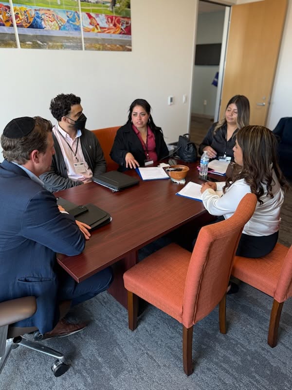 Coalition advocates meeting around a conference table with a policymaker